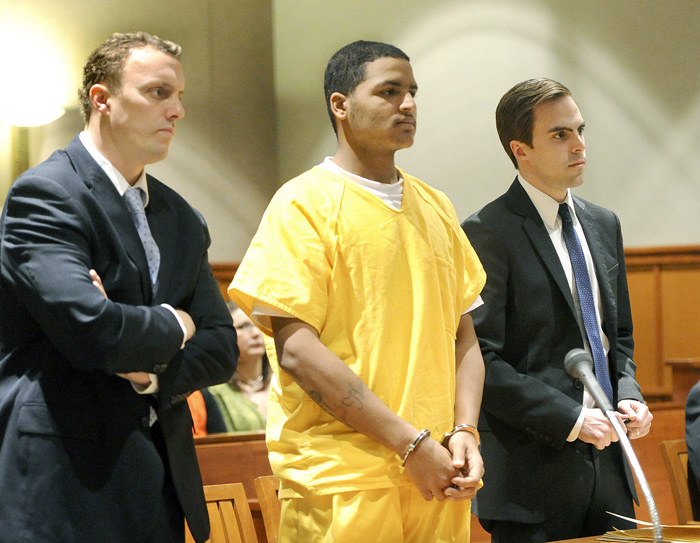 In this April 26, 2013 file photo, Anthony Pratt Jr. is flanked by attorneys Peter Cyr and Dylan Boyd. Pratt, 19, of Far Rockaway, N.Y. is accused of murdering Margarita Fisenko Scott last January in Portland.