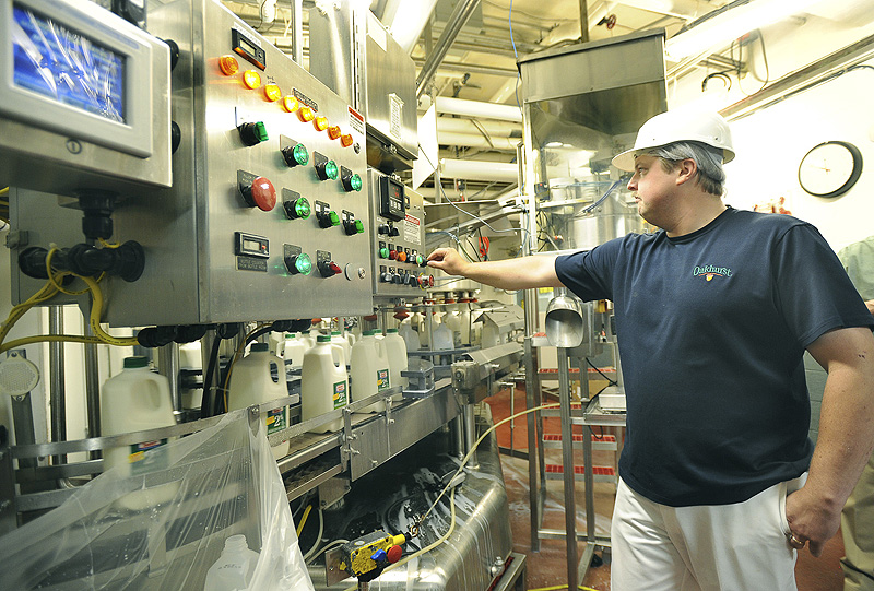 Filler operator Chris Roberts keeps a eye on controls at the Oakhurst Dairy plant in Portland.