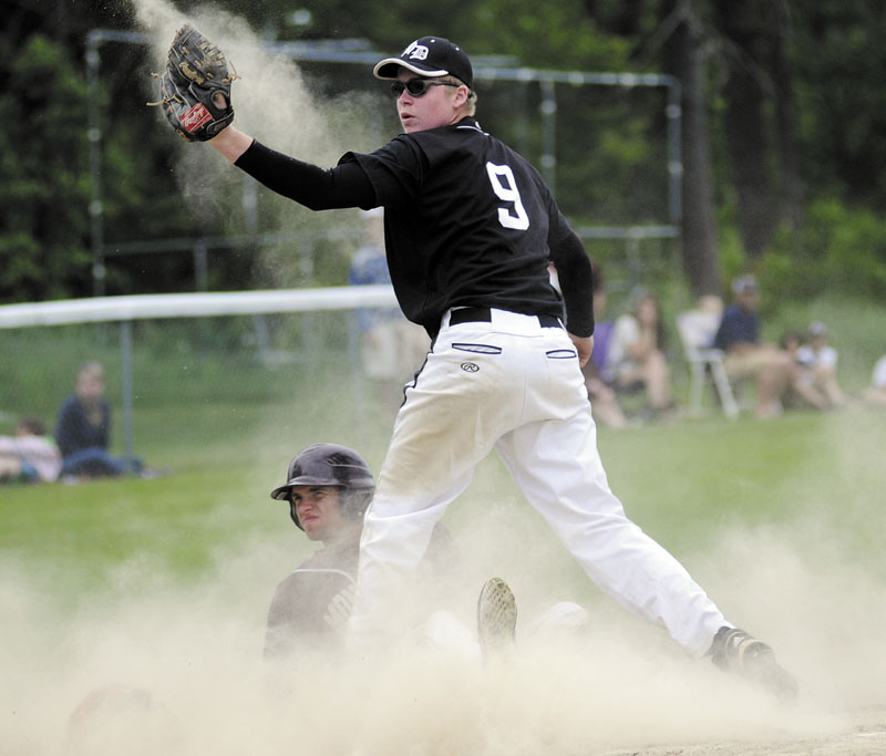 SAFE OR OUT? Hall-Dale’s Brian Allen comes up with the tag at home of Monmouth’s Devin West for the final out of a Western Class C quarterfinal game Thursday in Farmingdale. Hall-Dale won 5-3.