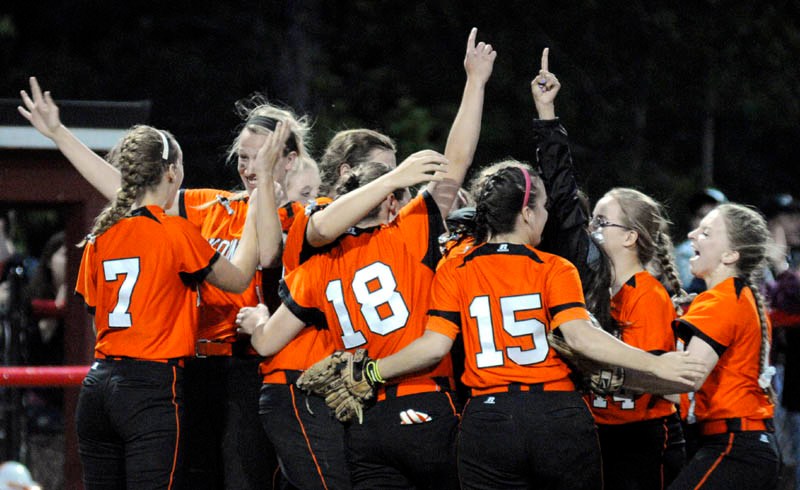 WE DID IT: The Skowhegan softball celebrates at the mound after winning the Eastern A title with a 2-0 win over Bangor on Thursday at Cony High School in Augusta.