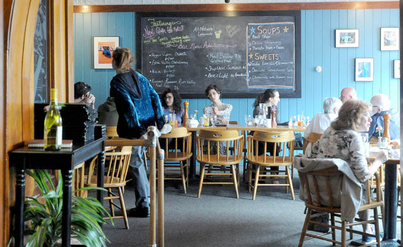 Diners eat lunch at The Last Unicorn in downtown Waterville on Friday.