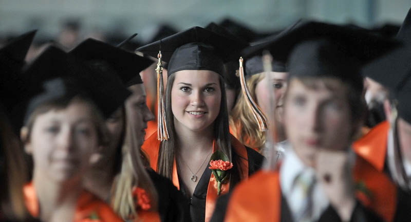 Megan Samsouci smiles as she gathers with her graduating class in the Alfond Ice Arena before commencement ceremonies at Wadsworth Gymnasium at at Colby College in Waterville on Wednesday.