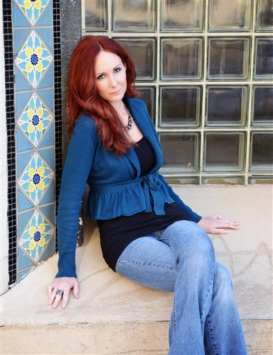 In this undated photo, actress Shannon Richardson poses for a photo, in Texarkana, Texas. Richardson made an initial appearance in a Texarkana, Texas, courtroom Friday after being charged with mailing a threatening communication to the president. She could face up to 10 years in prison if convicted, U.S. attorney's office spokeswoman Davilyn Walston said.