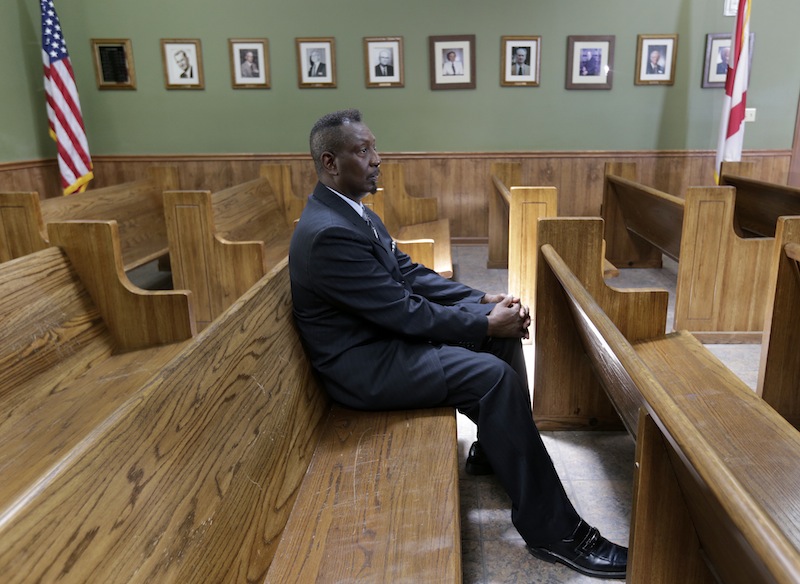 Calera City Council member Ernest Montgomery sits in the council chamber in Calera, Ala., Tuesday, June 25, 2013. A ruling by a deeply divided Supreme Court on Tuesday halted enforcement of the federal government's most potent tool to stop voting discrimination over the past half century, saying it does not reflect racial progress. Montgomery, a lifelong resident of Shelby County, said he wouldn't have ever been elected to his seat on the Calera City Council without the voting rights act. (AP Photo/Dave Martin)