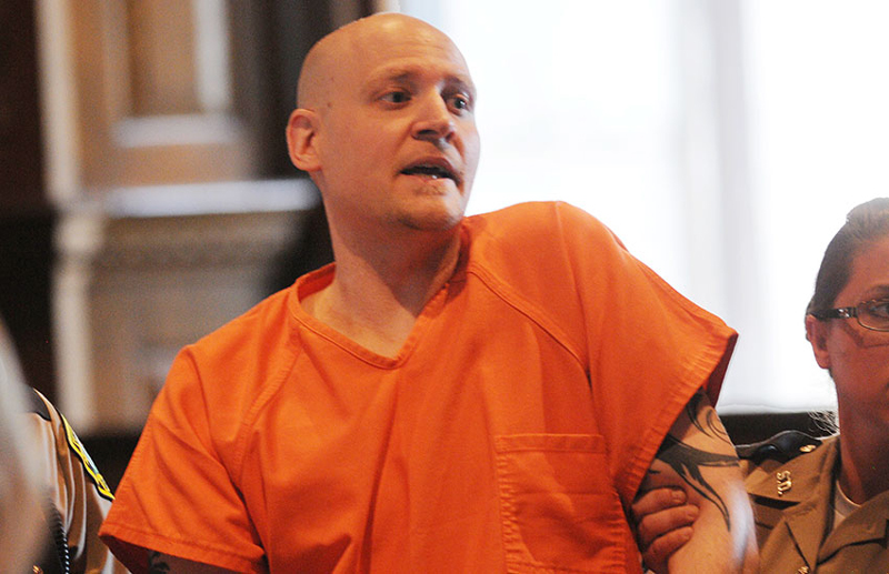Wade Hoover is escorted from Kennebec County Superior Court in Augusta on Tuesday morning after refusing to enter a plea.