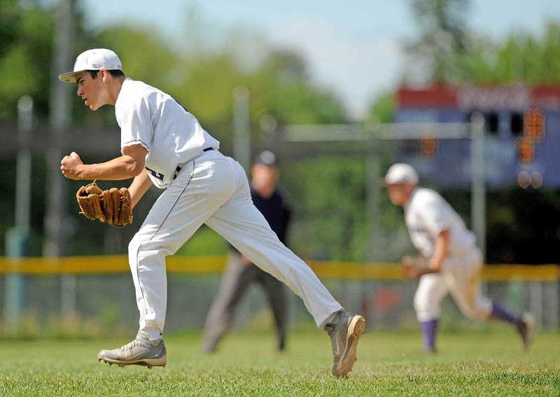 PSYCHED: Waterville Senior High School pitcher Brian Bellows, left, celebrates a strikeout against Presque Isle High School in an Eastern Maine Class B prelim game on Tuesday in Waterville. Waterville defeated Presque Isle 4-1.