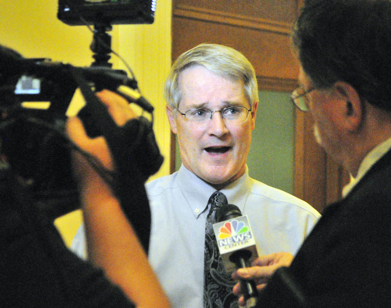 Sen. Patrick Flood, R-Winthrop, talks to reporters outside the Appropriations Committee room on Friday at the State House in Augusta.