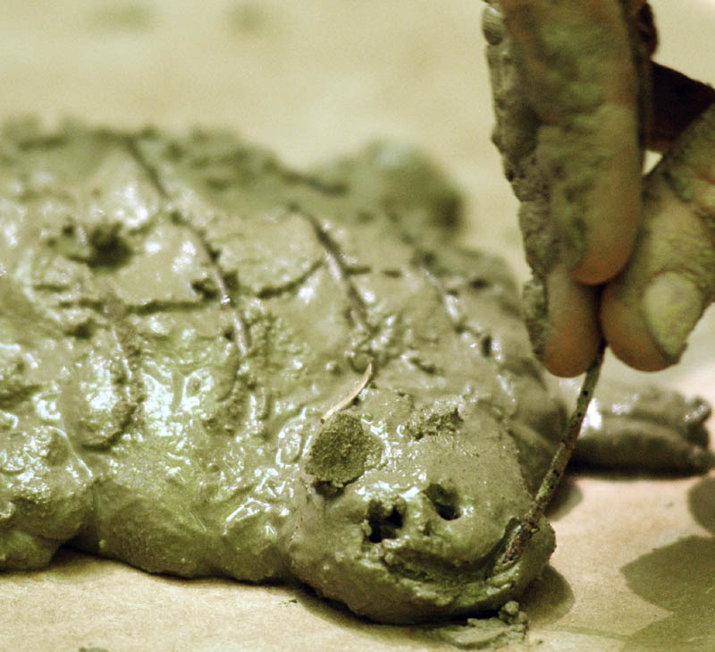 William Dollhopf, 10 of Pottstown, Pennsylvania, sculpts a turtle from clay dug up on the bank of a stream in the Small-Burnham Conservation Area on Tuesday in Litchfield.