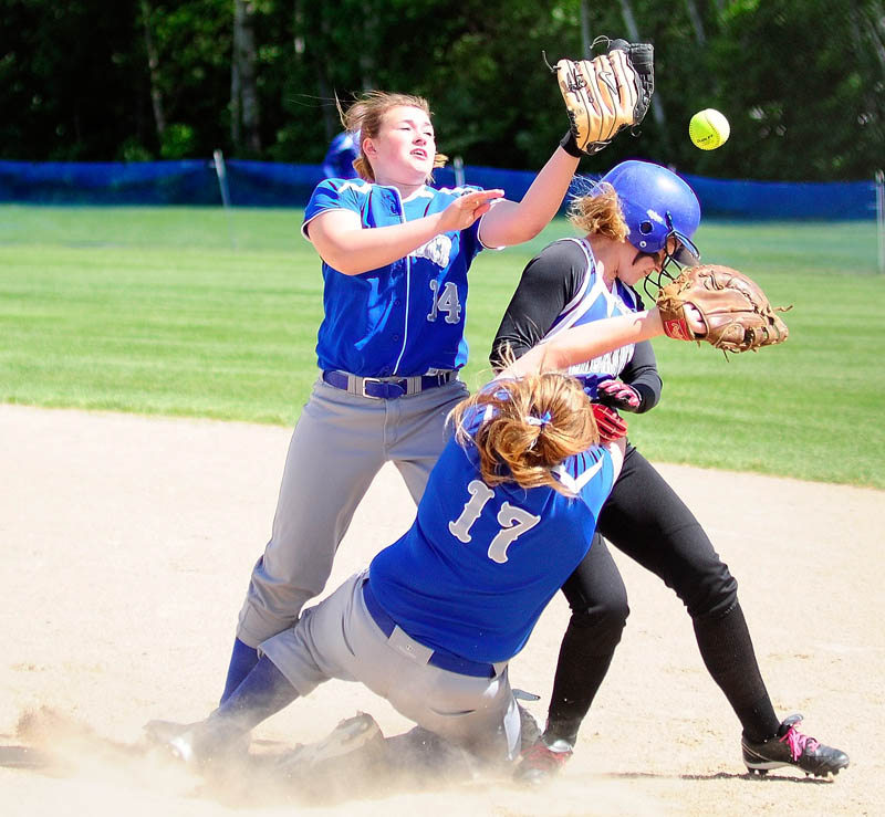 OUCH: Lawrence second baseman Audri Fortier, left, and first baseman Brianna Emery collide withan Erskine baserunner while going for a popup near first base during a game on Tuesday at Erskine Academy in China. Erskine won 6-5.