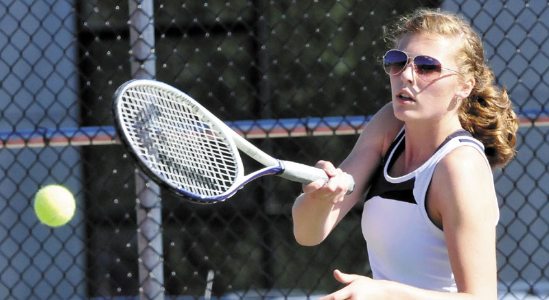 Taking a shot: Mt. Blue’s Savannah Swain returns a shot during her 6-0, 6-0 loss to Brunswick’s Leah Soloway in the Eastern A regional final Wednesday in Orono.