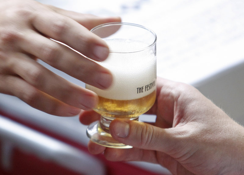 A sample is handed out from Hill Farmstead Brewery, which is located in Vermont, at Saturday’s festival.