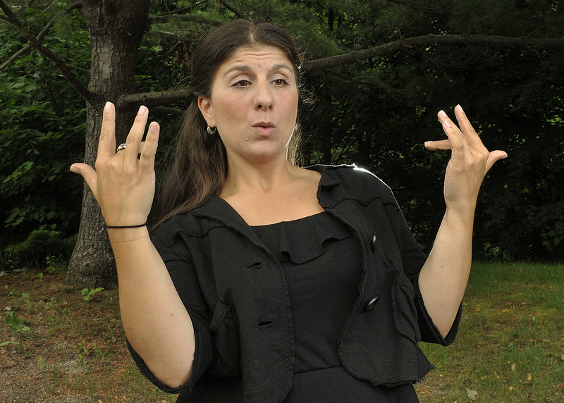 Holly Maniatty of Falmouth demonstrates her live music signing technique to the lyrics of Wu-Tang Clan’s “Protect Ya Neck.” Here she signs: "So what's up, man?"