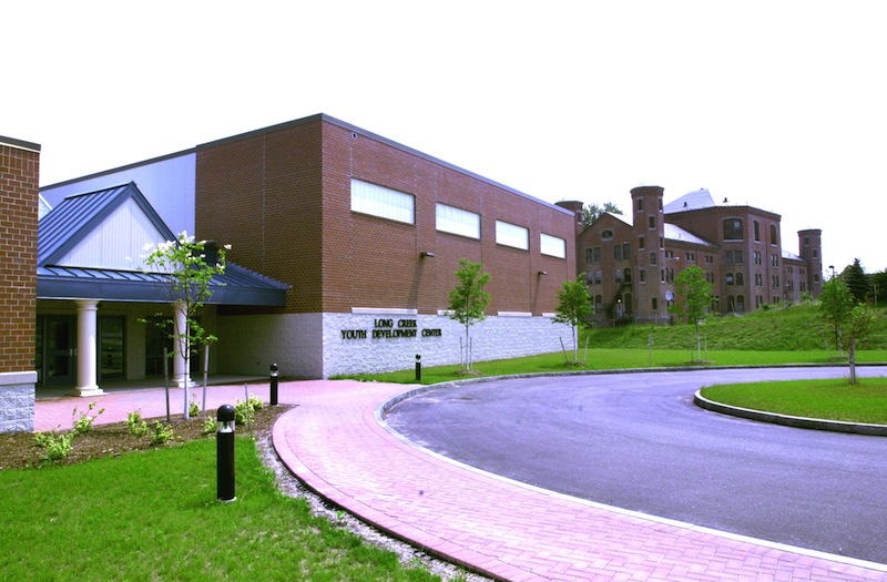 In this 2002 file photo, the Long Creek Youth Development Center with the old facility in the background. A new job training program at southern Maine's juvenile detention center, run by Goodwill Industries, will focus on forming and maintaining ties to area businesses to give juvenile offenders real world work experience before they are released, officials say. Castaway Children John Patriquin Long creek youth development center Maine's Most Vulnerable Kids youth center