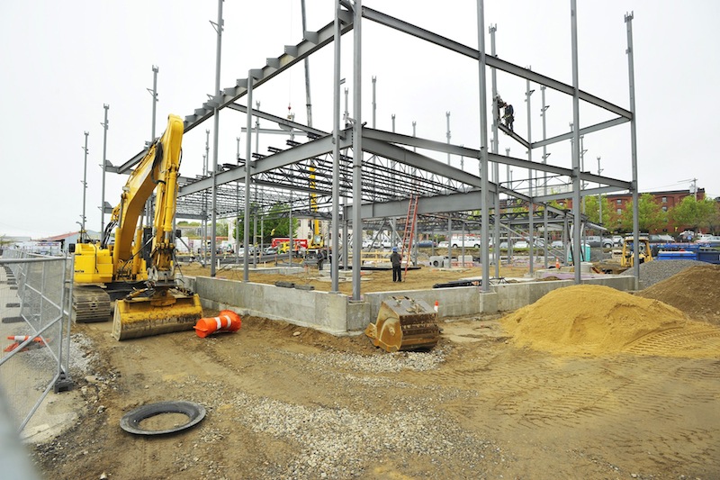 In this May 2013 file photo, construction work on the new Marriott hotel on Commercial Street in Portland. The Obama administration's decision to delay a health-insurance mandate in the Affordable Care Act will have the greatest impact on Maine construction and tourism-related businesses, because they are least likely to meet the requirement.