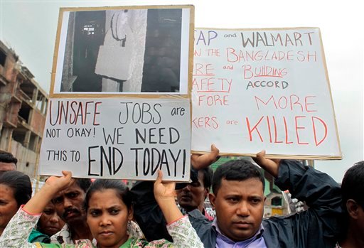 Bangladeshi garment workers, relatives and activists participate in a protest demanding that companies sign the Accord on Fire and Building Safety in Savar, Bangladesh, on June 29, 2013.