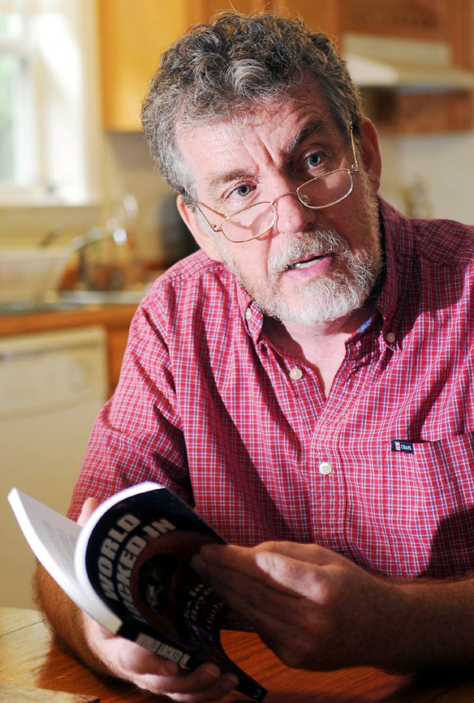 Mark Hathaway discusses his book, "World Locked In: Six Weeks in Coma and Beyond," today at his Litchfield home.