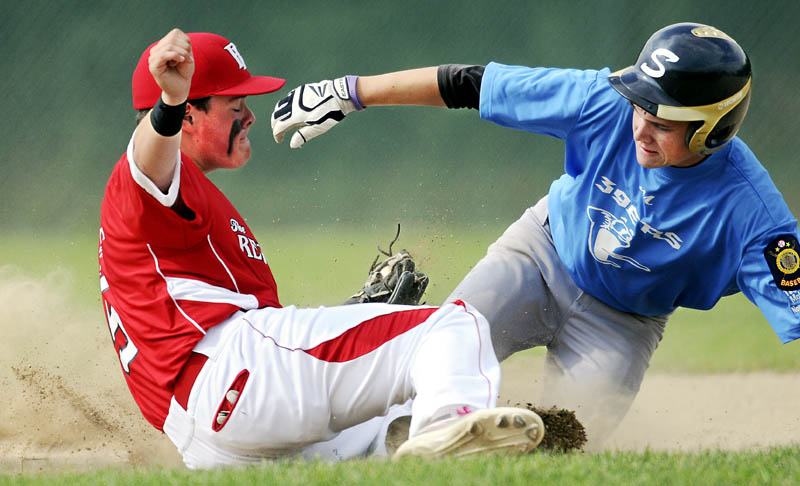 TAG HIM: Augusta Post 205's Tucker Whitman applies a tag to Madison Post 39's Trey Michonkski on Monday at second base during an American Legion tournament match up in Augusta.