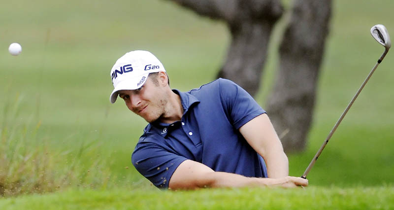 Jesse Speirs drives out of a bunker Monday during the first round of the Charlie's Maine Open Championship at the Augusta Country Club in Manchester.