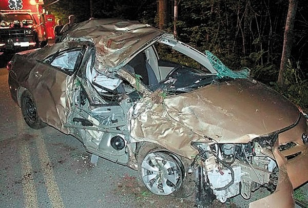 A 2011 Toyota Corolla is seen after crashing into a tree June 16, 2012 in Belgrade. The driver, Travis Lawler, 22, originally from the Oakland area was ordered to serve an initial four years behind bars for a drunken-driving crash that killed his sister and her boyfriend in Belgrade.
