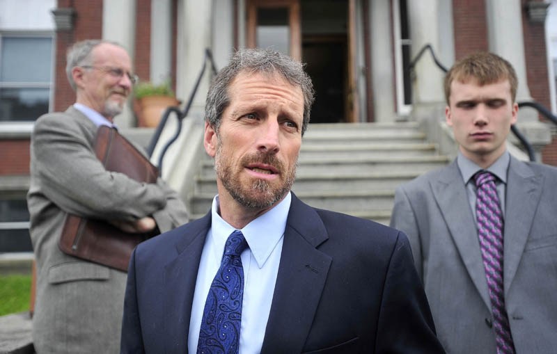 Phil Mohlar, center, attorney for Jason C. Cote, speaks to reporters following Cote's appearance in Somerset County Superior Court today.