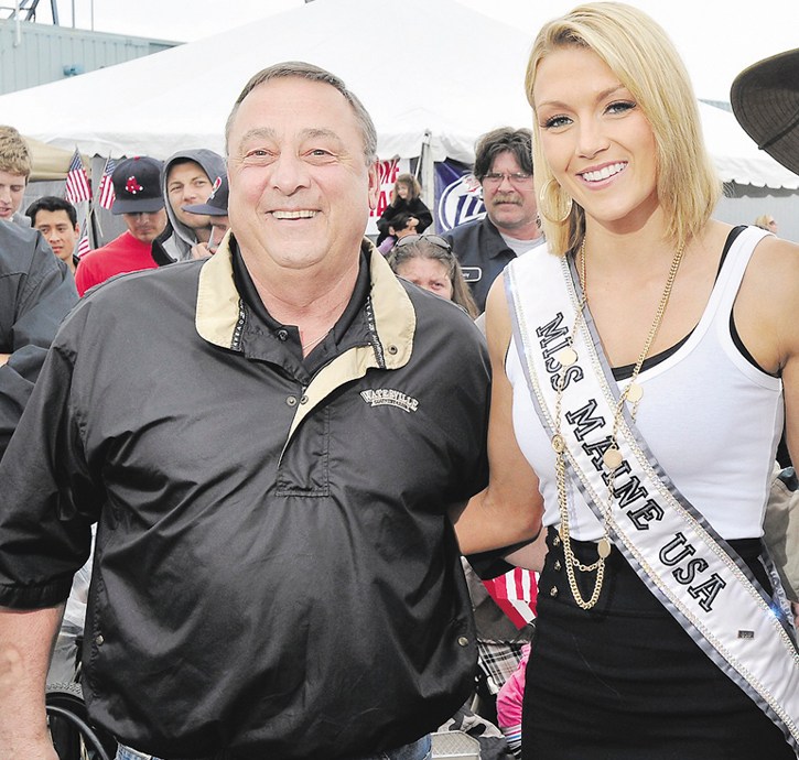 This file photo shows Gov. Paul LePage and then Miss Maine USA Ashley Marble at the 2011 Lobster Festival on Maine State Pier.