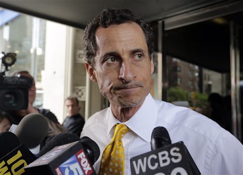 New York City mayoral candidate Anthony Weiner leaves his apartment building in New York on Wednesday, July 24, 2013. The former congressman acknowledged sending explicit text messages to a woman as recently as last summer, more than a year after sexting revelations destroyed his congressional career. (AP Photo/Richard Drew)