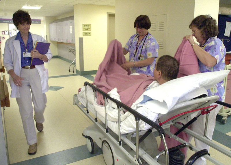 In this 2012 file photo, Linda Farley and Sharon Wallace, right, care for a patient at Maine Medical Center in Portland. Anthem Blue Cross and Blue Shield on Tuesday said it would have sufficient numbers of primary care physicians and specialists in its proposed health insurance network, but it acknowledged that not every town in the state would have a doctor in the network.