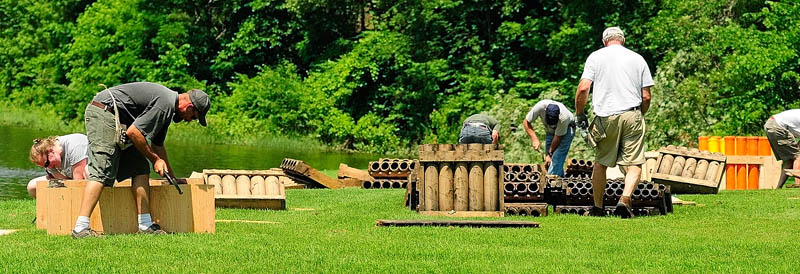 The crew from Central Maine Pyrotechnics sets up for their Independence Day show on Thursday at the Eastside Boat Landing.