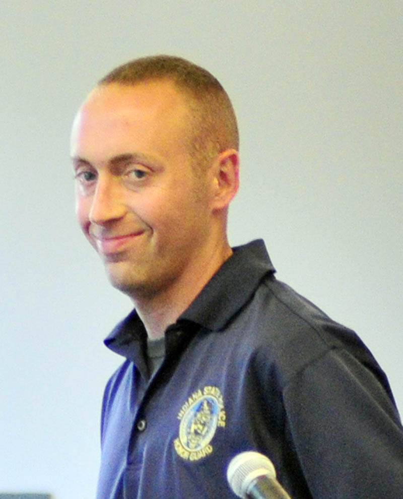 Indiana State Police Trooper Jarrod Lents meets with workers who helped make the ballistic vest that saved his life on Wednesday at TexTech Industries in North Monmouth.