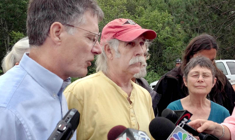 Read Brugger, left, Jim Freeman and Nancy Galland were among a group of demonstrators in Hermon Monday who called for more stringent inspection of Maine railways, following the deadly in train derailment in Quebec on Saturday.