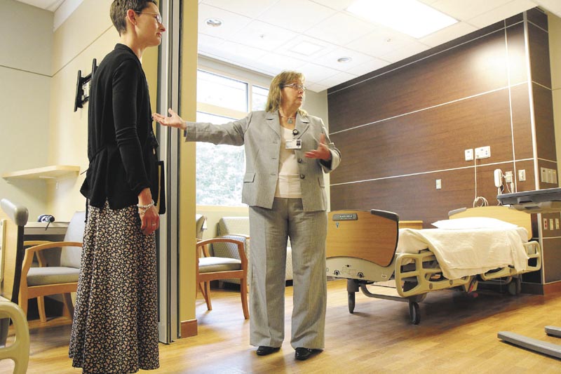 Sebasticook Valley Health acting President and CEO Terri Vieira, center, describes the amenities of a double occupancy room, called a super suite, in the hospital's new inpatient wing in Pittsfield on Wednesday. Looking on is Sebasticook Valley Health Marketing Manager Jennifer Yarbrough, left.