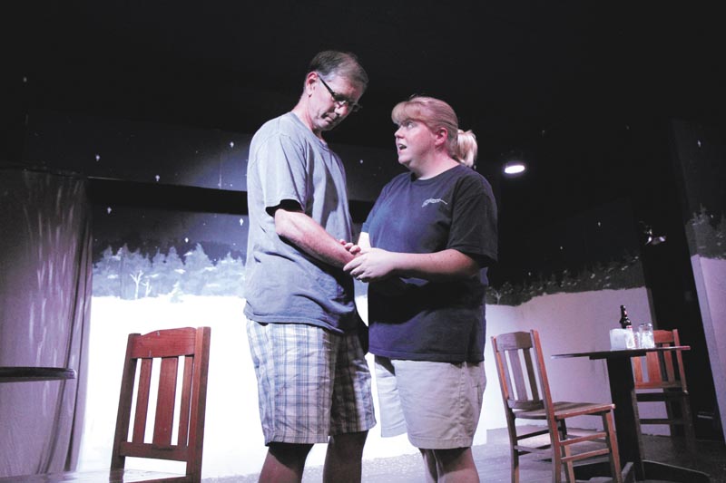 Kim Hilton, of Wilton, playing the part of Sandrine, right, rehearses a scene of "Almost, Maine," with Jimmy Cook of Waterville, playing the part of Jimmy, at the Sparrow's Nest Community Theater in Industry recently.