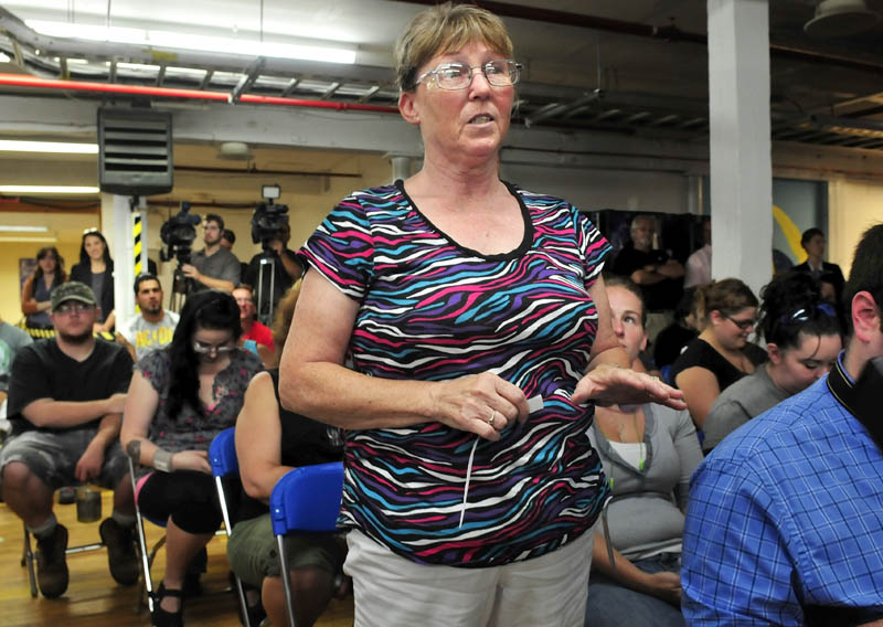 New Balance company employee Sue Burns addresses U.S. Trade Representative Michael Froman, who toured the Norridgewock plant today.