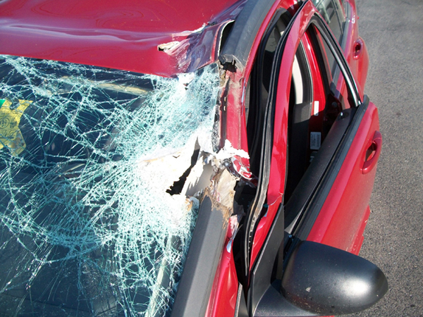 Sierra McGraw, 26, was driving south on Route 2 near Hight Chevrolet car dealership when her vehicle was hit by half of a manhole cover Wednesday morning.