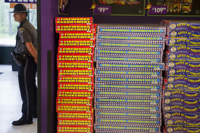 Scarborough Police Officer Michael Beeler is on duty at Phantom Fireworks in Scarborough on Tuesday, July 2, 2013. Management of Phantom Fireworks hired Scarborough Police for special duty as the Fourth of July approaches.