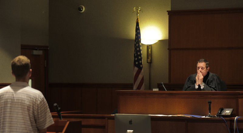 Judge Jeffrey Moskowitz listens to a client during a drug court session recently in Cumberland County Unified Criminal Court. For most of the existence of the program, a dedicated probation officer would attend the drug court sessions, but after a change of policy by state officials, that is no longer the case.
