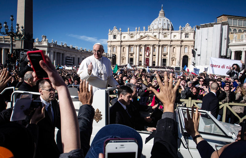 Pope Francis is driven through the crowd in St. Peter's Square for his inauguration Mass in March. The pope is forgoing the bulletproof popemobile for his trip to Brazil.