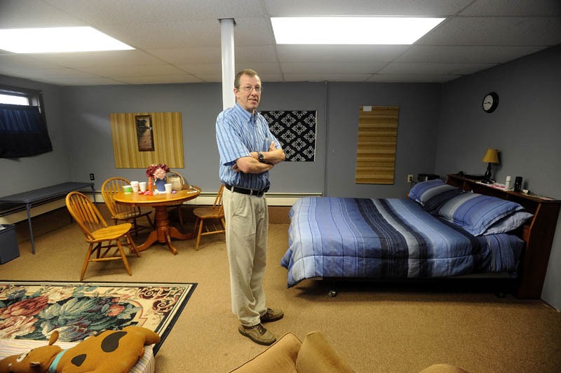 Steve Bracy, pastor of Living Waters Assembley of God Church and vice president of Western Maine Homeless Outreach, stands in the only private room at his church. An initiative to renovate the basement of his 547 Wilton Road church in Farmington, to help handle the needs of the homeless in the area, has recently begun.