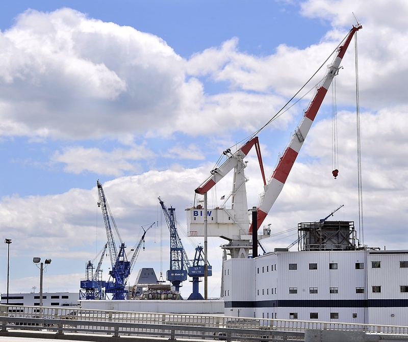 Familiar Bath Iron Works xcranes fill the sky across the highway in Bath. The company is looking for a city tax incentive to expand.