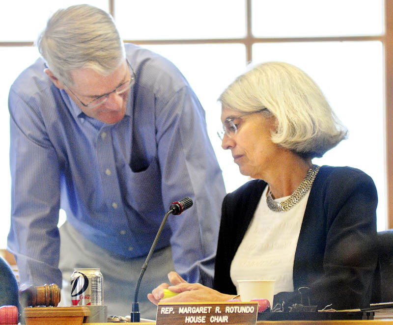 Sen. Patrick Flood, R-Winthrop, confers with Rep. Peggy Rotundo, D-Lewiston, during a meeting of the Legislature's Appropriations Committee Tuesday in Augusta.