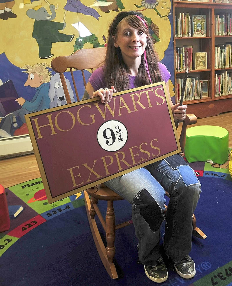 Alyssa Patterson, 33, a librarian at Lawrence Public Library, dresses up as her favorite Harry Potter character, Nymphadora Tonks, on Thursday. Patterson submitted the library's winning application to be one of the 15 locations that will participate in a Harry Potter 15-year anniversary celebration party.