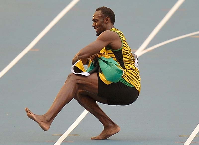 Jamaica's Usain Bolt dances as he celebrates winning gold in the men's 4x100-meter relay final at the world championships on Sunday.