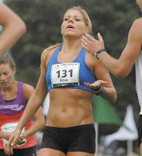 MAINE WOMEN'S WINNER: Scarborough's Erica Jesseman receives congratulations after crossing the finish line of the TD Beach to Beacon 10K road race as the first Maine woman Saturday in Cape Elizabeth.