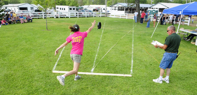 Stacy Goyette, 32, of Greene, competes in the Ladies Fry Pan Throwing Contest today at the Windsor Fair. Contestants were judged on distance they could throw the official steel competition skillet, but lost distance if the pan veered from a center line.