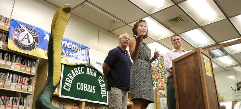 Carrabec High School Principal Regina Campbell talks about a federal grant that will bring 20 to 40 AmeriCorps volunteers to her school this year. The grant was announced at a press conference on Wednesday in North Anson. Looking on is school board member Bob Demchak, left, and Ethan Strimling, CEO of Learning Works, right. Strimling's organization will administer the grant.