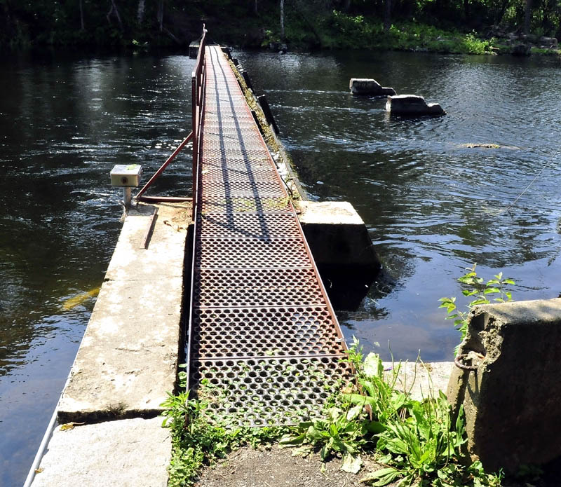 A dam at the outlet of Messalonskee Lake in Oakland on Monday. Its debris screen is shown at the top of the dam.