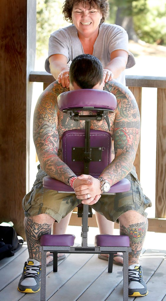 Anthony Webster of Windham, an Army veteran, gets a massage Saturday from volunteer and licensed massage therapist Christine Cornish.