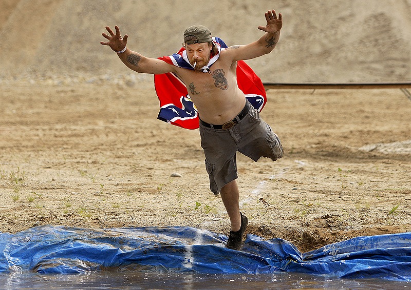 Jason Curtis of Naples goes flying into the mud pit.