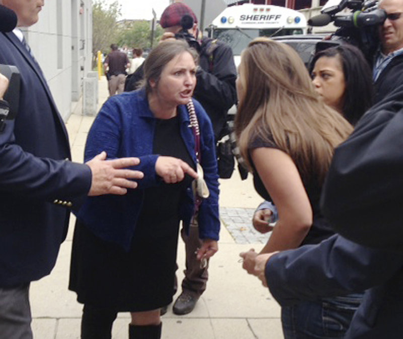 Trista Reynolds, right, and Phoebe DiPietro yell at each other outside the Cumberland County Courthouse on Wednesday, Sept. 25, 2013, in Portland, Maine. Reynolds, the mother of missing toddler Ayla Reynolds, confronted DiPietro about her son, Justin DiPietro, who is Ayla's father and had custody of her when she disappeared nearly two years ago. Ayla is presumed dead.