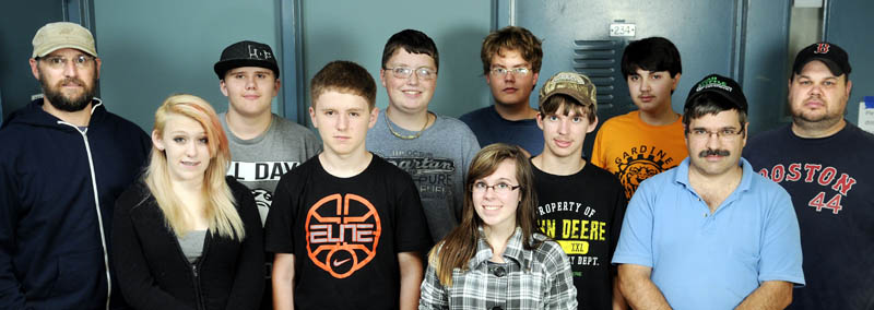Members of the Gardiner Area High School robotics team photographed on Sept. 10 are, from front row left, advisor Paul Seed, Kayla Sutter, Garrett Brown, Deanna Plaisted, advisor Marc Plaisted and advisor Aaron Basford, far right. Second row, from left, Jeff Kyllonen, Cameron Stevens, Everett Hotham, Harris Plaisted and Ian Basford.